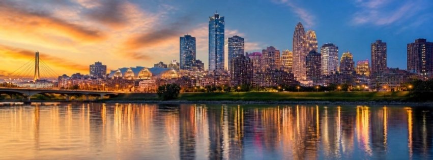 Local SEO Kansas City: metro skyline at dusk reflected on the river